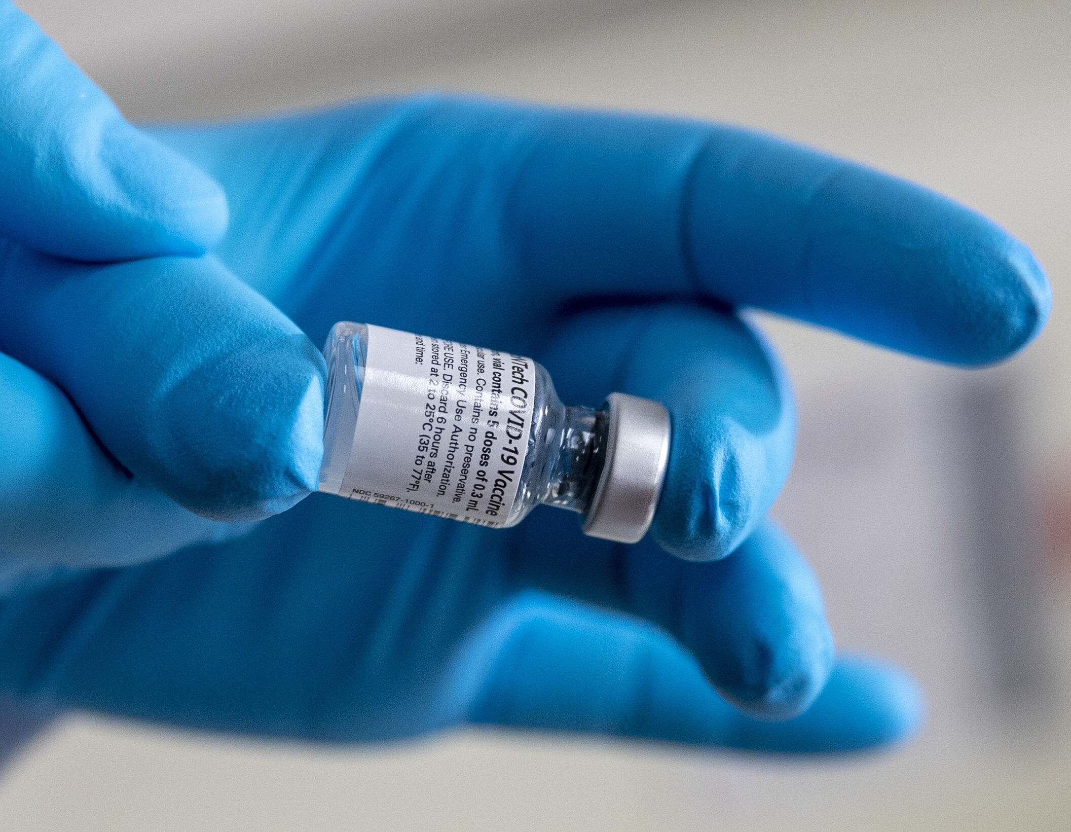 Army Spc. Angel Laureano holds a vial of the COVID-19 vaccine, Walter Reed National Military Medical Center, Bethesda, Md., Dec. 14, 2020. (DoD photo by Lisa Ferdinando)