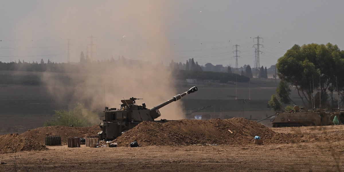 SDEROT, ISRAEL - OCTOBER 12: Israeli troops and artillery gather on the border with the Gaza Strip on October 12, 2023 near sderot, Israel. Israel has sealed off Gaza and conducted airstrikes on Palestinian territory after an attack by Hamas killed hundreds and took more than 100 hostages. On October 7, the Palestinian militant group Hamas launched a surprise attack on Israel from Gaza by land, sea, and air, killing over 1200 people and wounding more than 2800. Israeli soldiers and civilians have also been taken hostage by Hamas and moved into Gaza. The attack prompted a declaration of war by Israeli Prime Minister Benjamin Netanyahu. (Photo by Leon Neal/Getty Images)