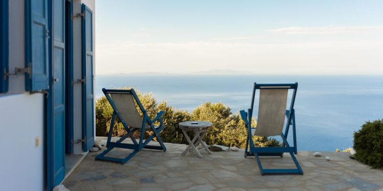 patio with a view, seaside in summertime. Folegandros, Cyclades, Greece